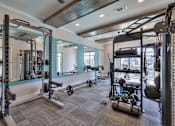 Thumbnail 19 of 31 - A well-equipped gym with a variety of exercise equipment.