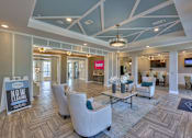 Thumbnail 20 of 31 - A living room with a leasing sign in the foreground.