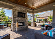 Thumbnail 19 of 31 - the preserve at ballantyne commons covered patio with fireplace and seating