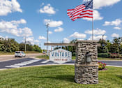 Thumbnail 31 of 31 - an flag flying over the entrance to a winery sign