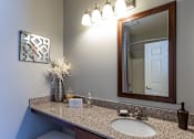 Thumbnail 9 of 28 - a bathroom with a sink and a mirror