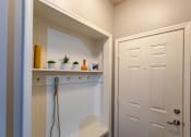 Thumbnail 5 of 28 - a laundry room with a closet and a white door