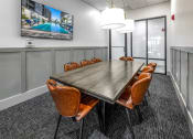 Thumbnail 13 of 48 - a conference room with a long table and chairs and a tv