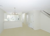 Thumbnail 16 of 36 - living area with view into kitchen
