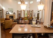 Thumbnail 7 of 18 - A dining room with a table set for a meal.