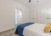 Thumbnail 9 of 33 - A bedroom with a bed, pillow, and blanket.