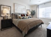 Thumbnail 15 of 21 - the preserve at ballantyne commons apartments bedroom with large bed