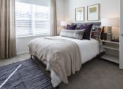 Thumbnail 17 of 21 - a bedroom with a bed and a window