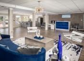 Thumbnail 4 of 31 - a living room filled with furniture and a large chandelier at Waterview at Rocky Point, Tampa, 33634