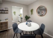 Thumbnail 17 of 31 - a dining area with a table and chairs and a kitchen in the background  at Waterview at Rocky Point, Florida