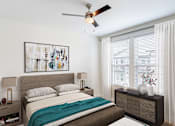 Thumbnail 40 of 50 - A bedroom with a bed, nightstand, and a painting on the wall.