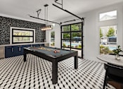 Thumbnail 18 of 30 - A black and white checkered floor in a room with a pool table.