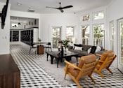 Thumbnail 19 of 30 - A black and white checkered floor in a living room.