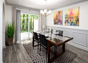 Thumbnail 5 of 30 - A dining room with a table set for two and a painting on the wall.