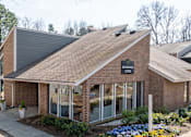 Thumbnail 27 of 31 - A brick building with a sign that says "MOONLAND".