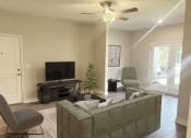 Thumbnail 12 of 31 - a living room with a couch and a tv