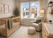 Thumbnail 35 of 71 - A baby's room with a crib, a chair, and a rug.