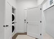 Thumbnail 7 of 40 - A white door with a black handle is on the left side of the image.