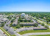 Thumbnail 3 of 29 - an aerial view of a city with buildings and a water tower