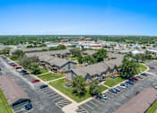 Thumbnail 5 of 29 - an aerial view of a neighborhood of houses in a parking lot