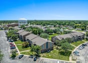 Thumbnail 6 of 29 - an aerial view of a neighborhood of houses with a water tower in the background