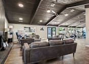 Thumbnail 15 of 29 - the preserve at ballantyne commons fitness room with couches and chairs