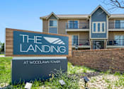 Thumbnail 1 of 29 - the landing sign in front of an apartment building