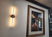 Thumbnail 6 of 27 - a picture of a deer hanging on a wall next to a light at The Lodge Apartments, Tulsa, 74129