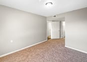 Thumbnail 14 of 14 - A room with carpeted floor and white walls.