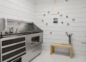 Thumbnail 11 of 40 - A kitchen with a stainless steel oven and a wooden bench.