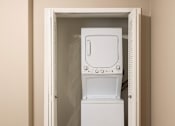 Thumbnail 11 of 35 - A white washing machine is in a doorway.