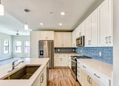 Thumbnail 2 of 50 - Modern Kitchen at Imperial Crossing Luxury Apartment Homes, Florida, 34134