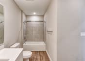 Thumbnail 7 of 49 - a bathroom with a shower and a toilet and a sink at Imperial Crossing Luxury Apartment Homes, Florida