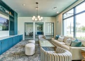 Thumbnail 32 of 49 - a blue and white living room with couches and a coffee table at Imperial Crossing Luxury Apartment Homes, Bonita Springs, Florida