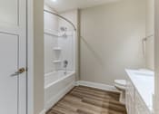 Thumbnail 23 of 31 - A white bathroom with a toilet, sink, and bathtub.at Tiffany Flats, Columbus, OH