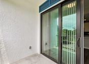 Thumbnail 11 of 71 - A glass door with a handle and a window on the other side.