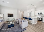 Thumbnail 4 of 30 - A modern living room with a white sofa set and a glass coffee table.