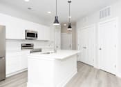 Thumbnail 17 of 31 - A white kitchen with a sink and a microwave.at Tiffany Flats, Ohio, 43231
