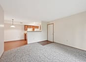 Thumbnail 39 of 41 - A room with a grey carpet and a wooden floor.