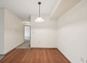 Thumbnail 12 of 41 - A room with a wooden floor and a white ceiling.