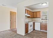 Thumbnail 2 of 28 - A fully equipped kitchen with appliances like refrigerator, stove, oven, and dishwasher, of an available home for rent at Cabot's Mill near Columbus, OH.