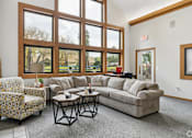 Thumbnail 26 of 26 - The clubhouse and leasing office at The Woods at McNeil Farms welcomes you! Enjoy amenities like a shared space, pool, and on-site laundry facility.