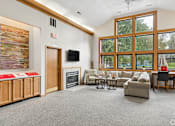 Thumbnail 23 of 26 - The clubhouse and leasing office at The Woods at McNeil Farms welcomes you! Enjoy amenities like a shared space, pool, and on-site laundry facility.