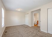 Thumbnail 22 of 23 - A room with a carpeted floor and white walls.