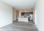 Thumbnail 15 of 37 - Living room with kitchen at The Flats at Summit Station, South Park