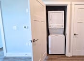 Thumbnail 7 of 16 - In-unit washer and dryer in the living area of an apartment at Greenwood Commons Apartments in Delaware, OH.