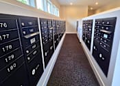 Thumbnail 13 of 16 - Secure mailboxes and package area at Greenwood Commons.