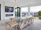 Thumbnail 10 of 49 - A modern outdoor seating area with a view of the city.at Imperial Crossing Luxury Apartment Homes, Bonita Springs, FL