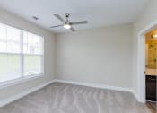 Thumbnail 23 of 37 - Bedroom with ceiling fan and light at The Flats at Summit Station, South Park