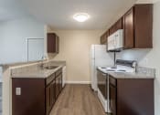 Thumbnail 4 of 19 - Kitchen cabinets at Bayside Apartment Homes, Hilliard